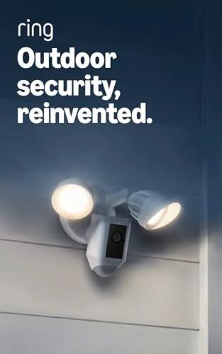 Ring Floodlight Cam Wired Plus outdoor security camera with dual floodlights, white, mounted on exterior wall.
