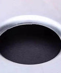 Close-up of a smooth hole created by the Heavy Duty Hole Punch And Flare Tool For Metalworking Black Finish Half Inch Dimple Plate Dies For 16 Gauge Steel
