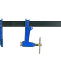 Premium Steel Plunger Screw Clamp Featuring Beefy T Handle And No Nonsense Non Slip Braking Mechanism For Killer Holding Power On Demanding Construction Sites in blue with metal bar.