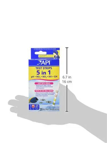 Heavy Duty 5 In 1 Aquarium Test Strips Freshwater And Saltwater Fish Tank Monitor PH Nitrite Nitrate Carbonate Hardness 25 Count Box held in hand.