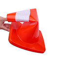 Person bending a 12 Pack 18 Inch PVC Traffic Cone For Road Work And Parking Lot Safety, showing its flexibility and durable construction.