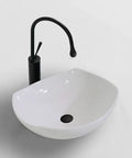 USZWBY Vessel Sinks Bathroom Vessel Sink Modern Simple Creative White Art Counter Basin Hotel Apartment Ceramic Wash Bathroom Bowl Sink with black faucet top view