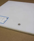Durable White UHMW Plastic Sheet 5/8 Inch Thick 24 By 24 Inches Built To Last Self Lubricating With Low Friction displayed at an angle.