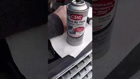 Mass Air Flow Sensor Cleaner For Cars And Trucks Safe On Plastics And Electronics Dyno Proven To Boost Horsepower And Improve Air Fuel Ratio Reduces Rough Idle And Hesitation Improves Gas Mileage Leaves No Residue 4.5 Oz can placed near car engine.