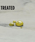 Pro Grade Nano Quartzite Sealer Plus Heavy Duty Stone Guard Solvent Based Impregnating Formula on treated marble showing liquid beads.