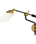 Level Up Your Interior Game With This Sick One Light Swing Arm Wall Sconce Decked Out In Matte Black And Modern Brass Details Paired With A Bright White Glass Shade For Smooth Lighting Vibes Anywhere, featuring a matte black finish and pivoting white glass shade.