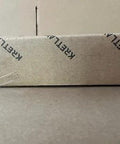 KRETLAW mini grease gun packaging box with repeated branding on brown cardboard.