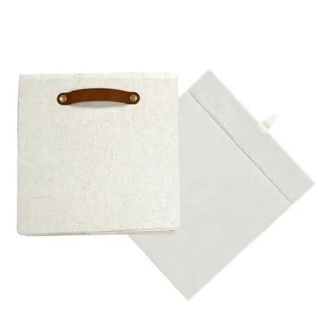 A Straight Up Game Changer Collapsible Fabric Cube Storage Bin Vanilla Canvas Organizer Tote With Sturdy Cut Out Handles, off-white fabric.