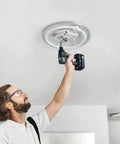 Built Tough 18V Compact Cordless Drill Workhorse Kit featuring quick charge dual batteries being used by a man on a ceiling installation.