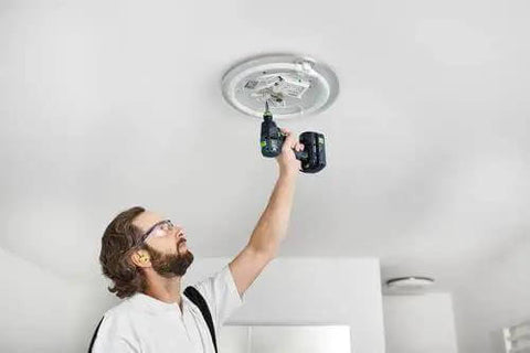 Built Tough 18V Compact Cordless Drill Workhorse Kit featuring quick charge dual batteries being used by a man on a ceiling installation.