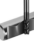 Close-up of carbide square end mill bit, 1/2 in, 4-flute, cutting into a steel bar
