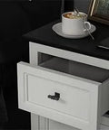 Heavy Duty Matte Black Cabinet Knobs Bring A Slick Two Tone Vibe With Rock Solid Square Drawer Pulls For Kitchen Cupboards And Dressers 15 Pack on a white nightstand with open drawer.