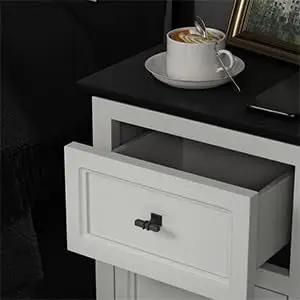 Heavy Duty Matte Black Cabinet Knobs Bring A Slick Two Tone Vibe With Rock Solid Square Drawer Pulls For Kitchen Cupboards And Dressers 15 Pack on a white nightstand with open drawer.