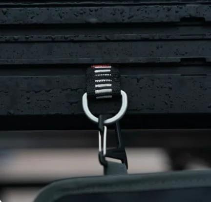 Close-up of T Slot Loop 4 Pack Heavy Duty Roof Rack Tie Down Anchors for Roof Top Tents, showing aluminum D ring attachment system.