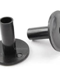 Two black plastic coaxial cable feed-through wall protector bushings.