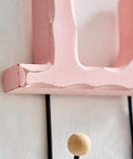 Close-up of Pack Of 2 Killer Wall Mount Hooks Designed With Real Deal Home And Love Script Designs in black and pink finish.