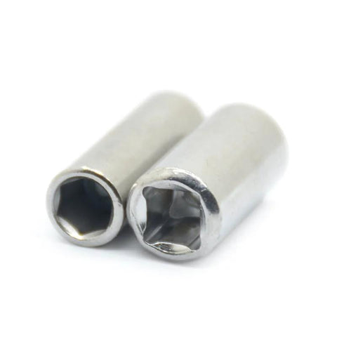 Two silver metal 1/4 square to 1/4 hex drive adapters with hollow female ends