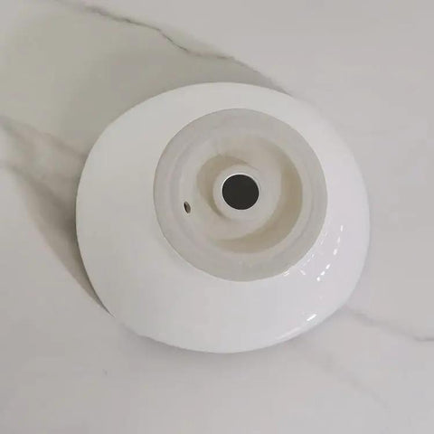 USZWBY Vessel Sinks Bathroom Vessel Sink Modern Simple Creative White Art Counter Basin Hotel Apartment Ceramic Wash Bathroom Bowl Sink top view showing inner bowl and drain hole.