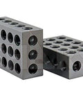 Two hardened steel 1-2-3 precision blocks with multiple round holes, angled front and side views
