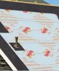 Top Shelf Synthetic Roofing Underlayment 4 X 250 Feet Roll Heavy Duty Polymer Sheets on sloped roof with chimney.