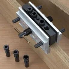 Self Centering Doweling Jig With Six Hardened Drill Bushings on round stock, showing 1/4, 5/16, 3/8 inch bushing sizes and use