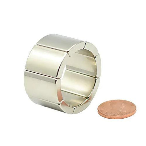 NdFeB N42H arc-segment magnet ring, 36 mm diameter, 20 mm height, eight magnets; for generators (penny for scale).