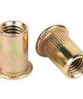 Close-up of zinc plated carbon steel flat head nuts from Rivet Nut Kit With 413-Piece SAE UNC Assortment for Auto and DIY Projects.