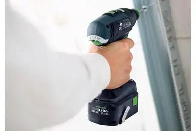 Professional 18V Cordless Drill And Driver Tool With Quick Change Chuck System Hella Versatile For Wood Metal And Garage Work Smooth Grip Fast Charge Battery Included Bright Led Light Variable Speed Trigger Top Tier Performance Rig in hand close-up.