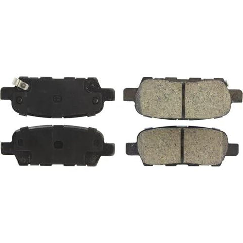 Centric POSI-QUIET rear brake pads set of four with beige friction material and dark backing plates.