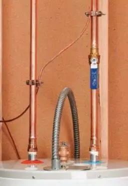 Heavy Duty Bronze Water Pipe Ground Clamp Fits One Quarter To Two Inches attached to copper tubing for secure electrical bonding.