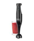 Black Two Speed Immersion Blender with Heavy Duty Stainless Steel Blades and Ergonomic Handle Easily Purees Soups Whips Sauces and Mixes Batters No Sweat One Touch Control plus Detachable Head for Dishwasher Cleaning a Snap Home Chef Essential next to a glass of blended berry smoothie.