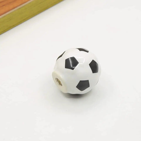 Solid Ceramic Soccer Knobs Four Pack Football Drawer Handles For Kids Bedroom And Man Cave Sports Decor Dresser Cabinet Pulls Easy Install Badass Home Gear close-up of a glossy ceramic soccer knob