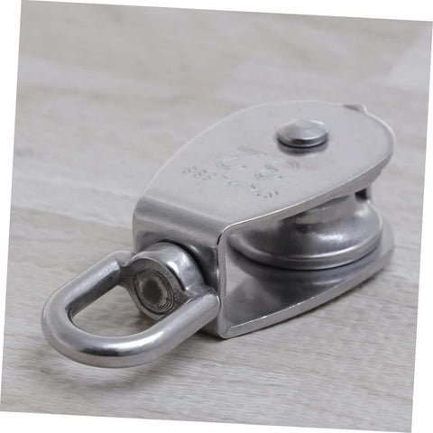 32mm Stainless Steel Single-Sheaved Pulley Roller Swivel Function Heavy Duty Wire Rope Pulley for Lifting Systems on wood surface