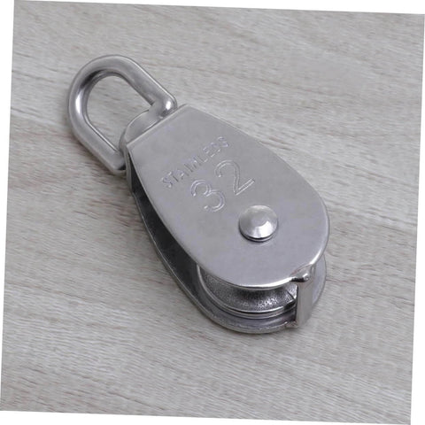 32mm Stainless Steel Single-Sheaved Pulley Roller Swivel Function Heavy Duty Wire Rope Pulley for Lifting Systems on wood surface