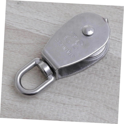 32mm Stainless Steel Single-Sheaved Pulley Roller Swivel Function Heavy Duty Wire Rope Pulley for Lifting Systems on wood surface