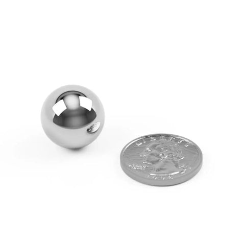 Close-up of a single 3/4 inch carbon steel ball bearing next to a coin for scale, part of Six Pack Large Three Quarter Inch Carbon Steel Ball Bearings Built For Beefy Heavy Duty Industrial And Mechanical Use With Hardened Wear Resistant Precision Ideal For Machinery Bearings Linear Motion And Tough Projects BC Precision.