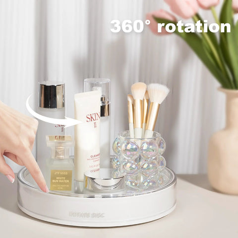 360 Degree Rotating Makeup Organizer With Perfume Tray And Skincare Holder, displaying cosmetics and brushes on a vanity.