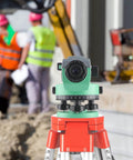 Professional automatic optical level with 36x magnification on tripod at construction site