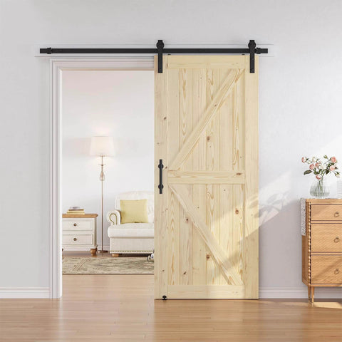 36 in x 84 in Sliding Barn Door with 6.6 ft hardware kit included, unfinished solid spruce wood door installed in living room doorway.