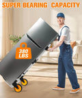 Man using ✝️ 380 LB Capacity Folding Hand Truck Heavy Duty Foldable Dolly Cart with Wheels in living room, moving a large fridge.