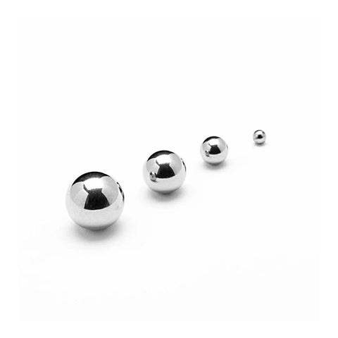Four shiny 304 stainless steel solid balls, including a 39mm ball focused in the foreground, used for precision machinery and bearings.