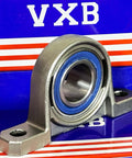 25mm Bore Miniature Stainless Steel Pillow Block Mounted Bearing on a blue and red box with VXTB logo.