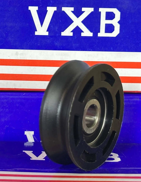Side view of 10mm Bore Bearing - 50mm Round Pulley V-Groove Track Roller Bearing 10x50x16mm with blue and red background.
