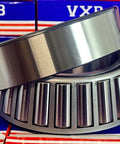 33121 Tapered Roller Wheel Bearing 105x175x56mm, chrome steel, showing cone and cup, front view with VXB packaging background.