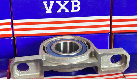 30mm Bore Miniature Stainless Steel Pillow Block Mounted Bearing on display with blue and red packaging.
