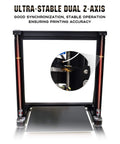 Close-up of 3D printer with focused view on dual Z-axis ensuring synchronization, featuring red vertical supports.