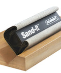4 In 1 Sanding Block For Flat Convex Concave And Round Surfaces on wood showcasing its versatility