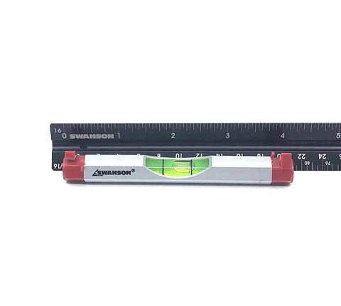 Compact 4 Inch Aluminum Line Level For Quick On The Job Or Home Projects With Tough Aluminum Build And Precision Vial For Accurate Readouts Swanson Tool shown next to ruler for scale.