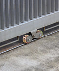 Two Pack Four Inch Solid Slide V Groove Wheels With Heavy Duty Sliding Gate Casters For Industrial Rails And Machinery One And Three Quarter Inch Width Gate Wheels With Screws And Double Bearings Corrosion Resistant Load Capacity Up To 1000 Lbs installed on gate rail