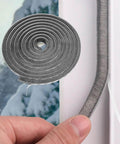 Close-up of 40FT Weather Stripping Door Seal with nylon brush being applied to window, showing self-adhesive backing for anti-draft insulation.